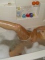 Busty teen chick taking bubble bath - Picture 11