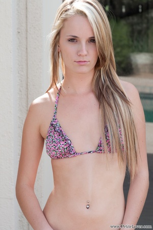 Slim blonde teen in a lovely bikini undr - Picture 1
