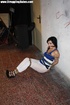 Hot brunette babe in a blue top with her tits out hogtied and with a gag-ball