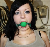 Brunette chick in jeans and with a gagball gets bound t the chair