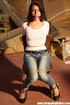 Hot red chick in jeans with a gag-ball gets roped tightly to the chair
