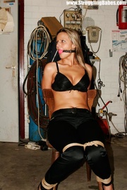 Blonde chick with a gag-ball and bound to the chair gets her tits pinched rudely