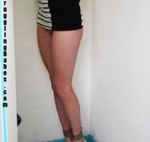 Blonde chick in a striped dress gets gagged and suspended in the shower