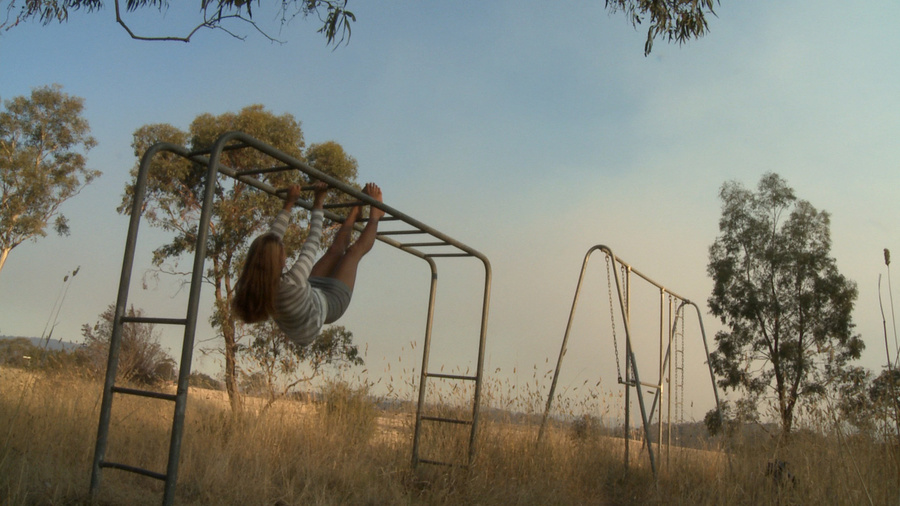 Long-haired blonde chick in a striped blouse swinging on the swings and then fingering her cooch in the field - XXXonXXX - Pic 1