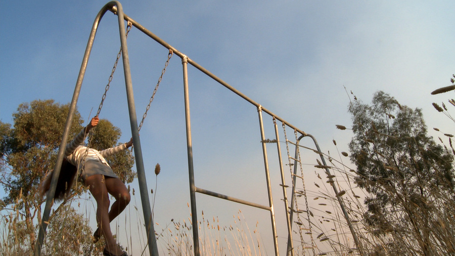 Long-haired blonde chick in a striped blouse swinging on the swings and then fingering her cooch in the field - XXXonXXX - Pic 3