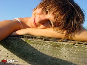 Hot short-haired girl with small tits taking off he blue panties to demonstrate her hairy snatch outdoors - XXXonXXX - Pic 4