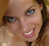 Long-haired blonde chick shows off her small-tits and shaved slit in the