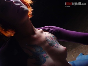 Dirty tattooed red-headed bitch tearing her blue tight on her cooch to expose it and her small tits - Picture 16
