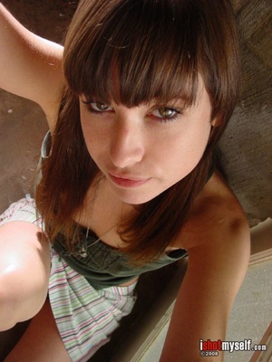 Pretty brunette teen girl enjoys posing on camera naked demonstrating her fresh delights - Picture 1