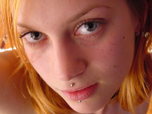 Teen blonde with a pierced eyebrow trying to shoot herself topless - Picture 6