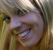 Blonde teen gal in a white shirt shoot herself on the bed