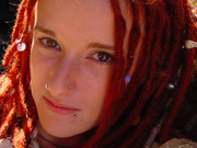 Red teen girl with dreads and piercing shooting herself on camera nude