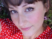 Lovely brunette teen in a red polka-dot dress shot herself on mobile