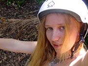 Red teen bitch in a white helmet shooting herself on the bike