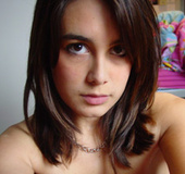 Lovely Asian chick taking her own picture on cam outdoors