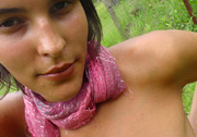 Very hot teen chick in a pink scarf shooting herself naked outdoors