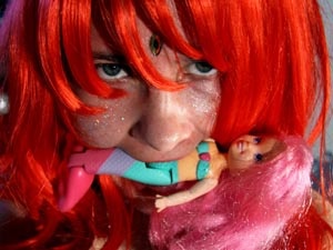 Kinky teen in a red wig with a Mermaid doll in her teeth shot herself on mobile - XXXonXXX - Pic 1