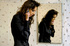 Curly chick in a leather jacket washes with hot jizz from the glory hole