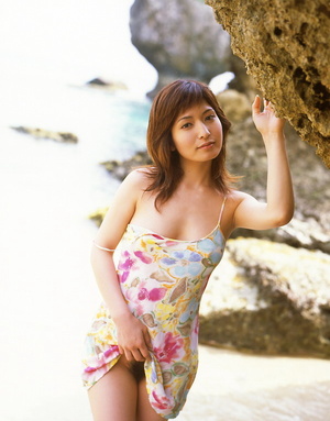 Lovely Asian chick posing in the sea and playing with a dildo - Picture 6