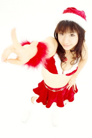 Pretty Asian girl poses in Santa's uniform on camera - Picture 10