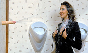 Curly vixen in leather suit gets sprayed heavily with sperm from the glory hole