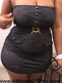 Chubby black mom in a short dress is - Picture 1