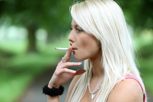 Blonde smoking teen takes off her USA-fl - Picture 3