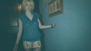 Busty blonde teen in blue blouse and black stockings stripping