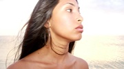 Hot latina teen posing nude on white sand