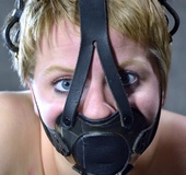 Blonde teen roped in a mask waiting her turn for femdom