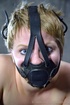 Blonde teen roped in a mask waiting her turn for femdom