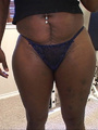 Busty black mom takes off her jeans - Picture 1