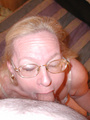 Slutty granny in glasses sucking cock - Picture 2
