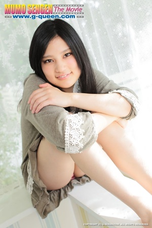 Japanese girl with beautiful eyes takes off her panties - Picture 3