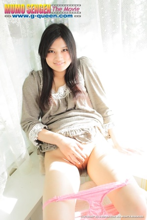 Japanese girl with beautiful eyes takes off her panties - Picture 9