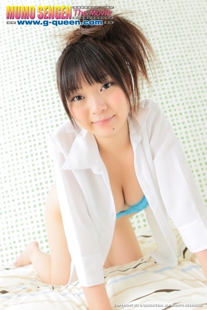 Busty Japanese teen in white dress changing into blue bikini - Picture 14