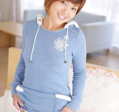 Short-haired red Asian teen in hoody demonstrating her tiny twat