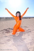 brunette orange latex jumpsuit