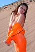 brunette orange latex jumpsuit