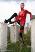 Slim and tall babe posing in red and black latex