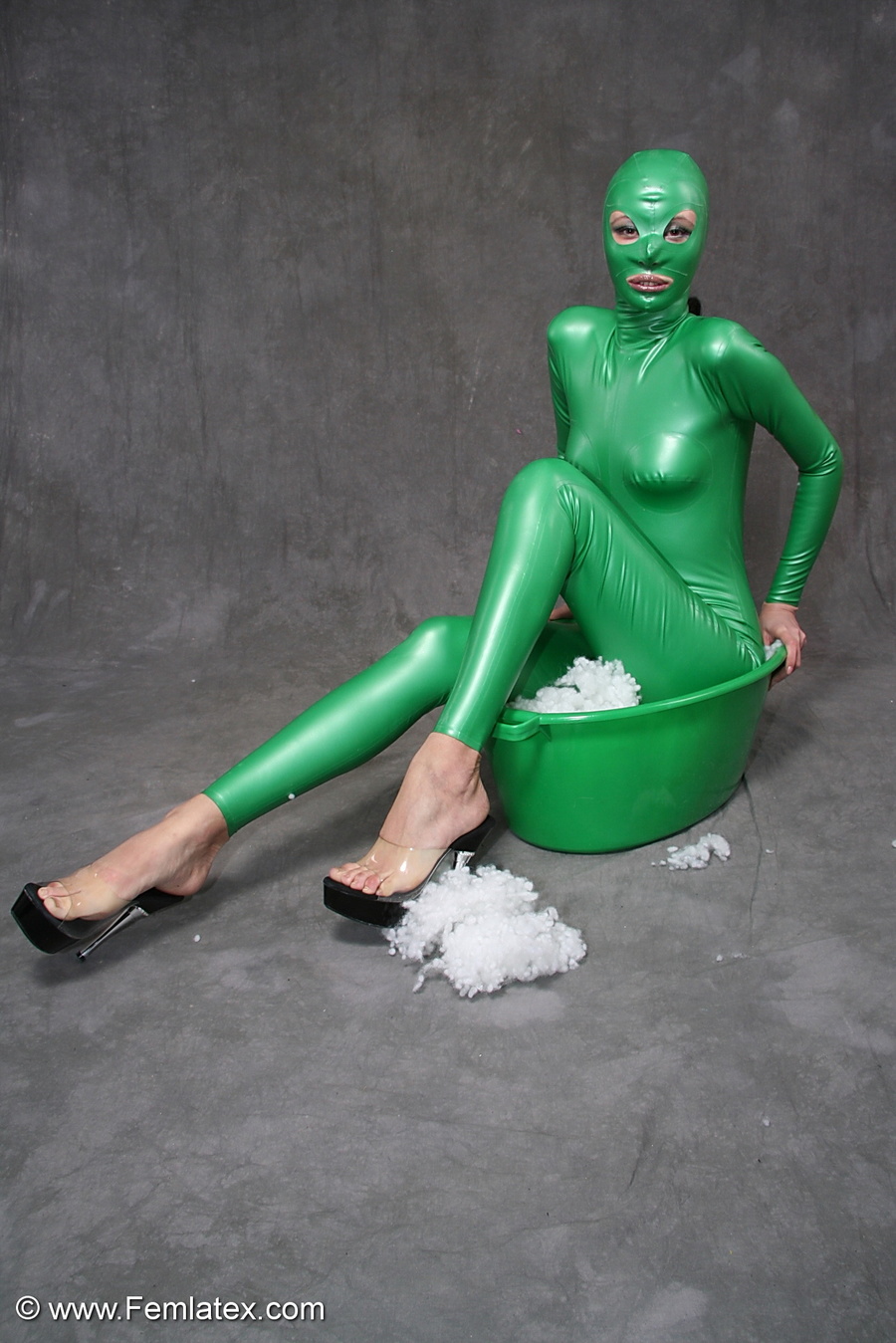 Busty babe in green latex jumpsuit posing w - XXX Dessert - Picture 10