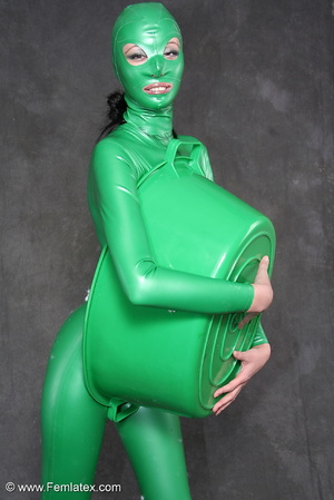 Busty babe in green latex jumpsuit posin - XXX Dessert - Picture 15