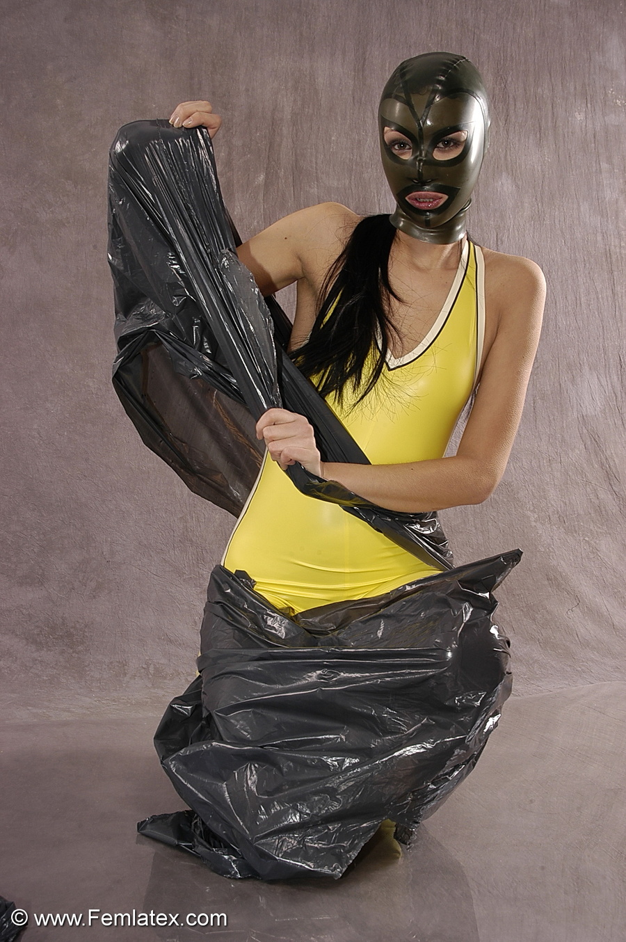 Masked girl in yellow latex comes out of a  - XXX Dessert - Picture 5