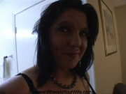Hot fine mama in black negligee smiles as she shows off her tattoos and needy body