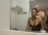 Hot cute ebony mama gets undressed in rest room and goes down to suck