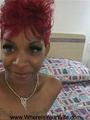 Smiling ebony in flaming hair color - Picture 1