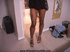 Sexy hot young tattooed ebony in black dress getting set on bed for hot