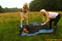 Two horny blondes rapes a man in the fields
