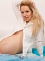 Young pregnant girl posing seductively - Picture 2