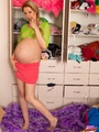 Pregnant girl in top and miniskirt shows - Picture 3